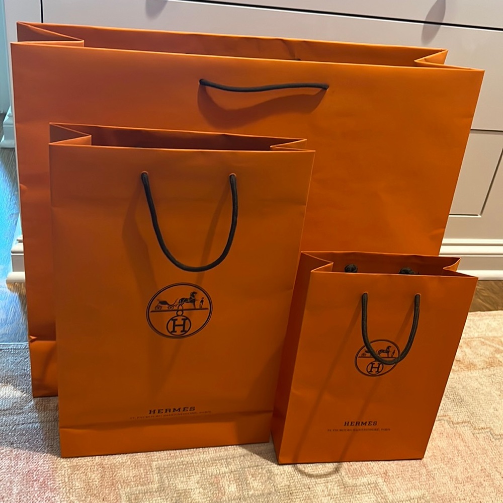 Set of three Hermes shopping bags, one each small, medium, and large